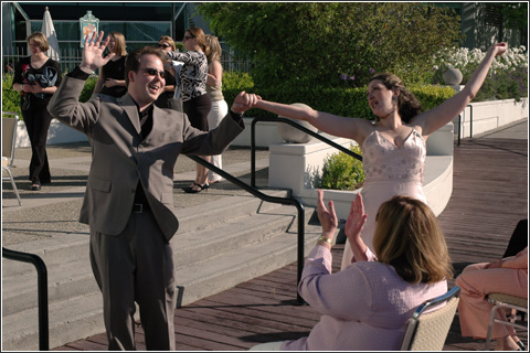 Jessyca and Mitch perform a post-ceremonial hooray during their rehersal.